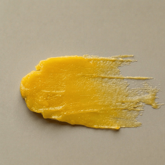 Aurora cleansing balm texture β rich golden balm that melts into a nourishing oil on contact