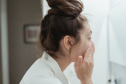Niacinamide serum dropper with soft natural light — climate-adaptive skincare for urban and seasonal skin stress