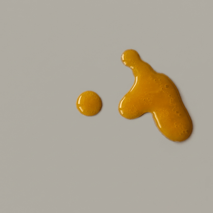 Midnight oil serum texture — rich amber oil with omega-7 fatty acids for overnight skin repair
